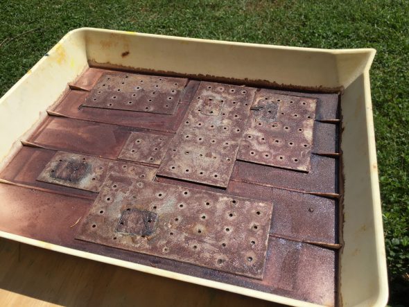 tray of galvanized steel rusting in the sun