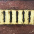 Title: Seven Bound Spikes | Dimensions: 23" x 33 | Medium: paint, plaster, railroad spikes, twine, and roofing tar on plywood |Year: 2018