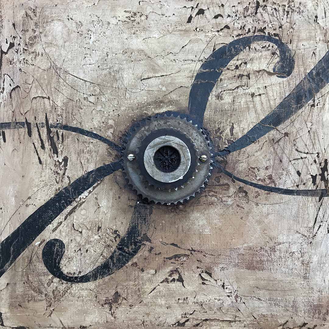 Wrapped in a Swash | 17” x 17” | sprocket, screws, paint, plaster, pencil, and tar on plywood | 2018