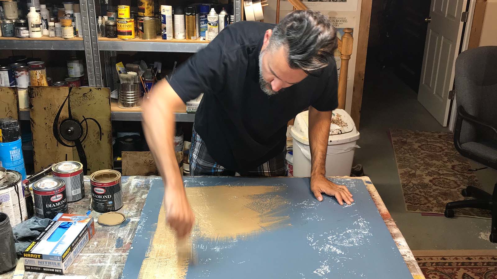 Domenick Naccarato working in his basement art studio in the summer of 2018.