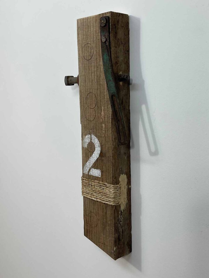 Remnants II: Two, Assemblage No. 12 | Apx. 16”x7”x2.5” | Hex bolt, washer, bracket, screw, nail, twine, bracket, paint, and wood filler on barn wood | 2018