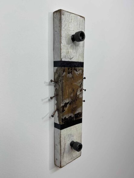 Remnants II: Assemblage No. 15 | Apx. 16" x 5.5" x 2.5" each | nails, paint, tar, tissue paper, double spur gear, socket head cap screws, and hex bolt on reclaimed pallet wood | 2018