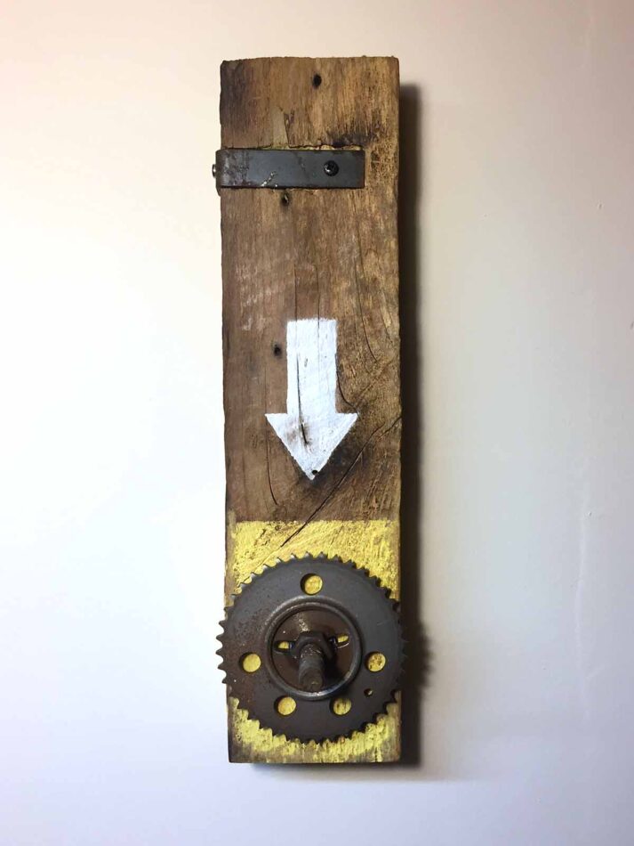 Remnants II: Assemblage No. 5 | Apx. 15” x 4” x 2” | barn wood, sprocket, machine screw, nut, washer, steel bracket, pan head screws, and paint | 2017