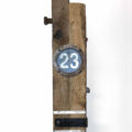 Remnants II: Twenty-Three, Assemblage No. 8 | Apx. 20"x6"x3" | bolt, faceplate ring, bracket, tube strap, screws, nails, epoxy, wood filler, and paint on barn wood | 2018