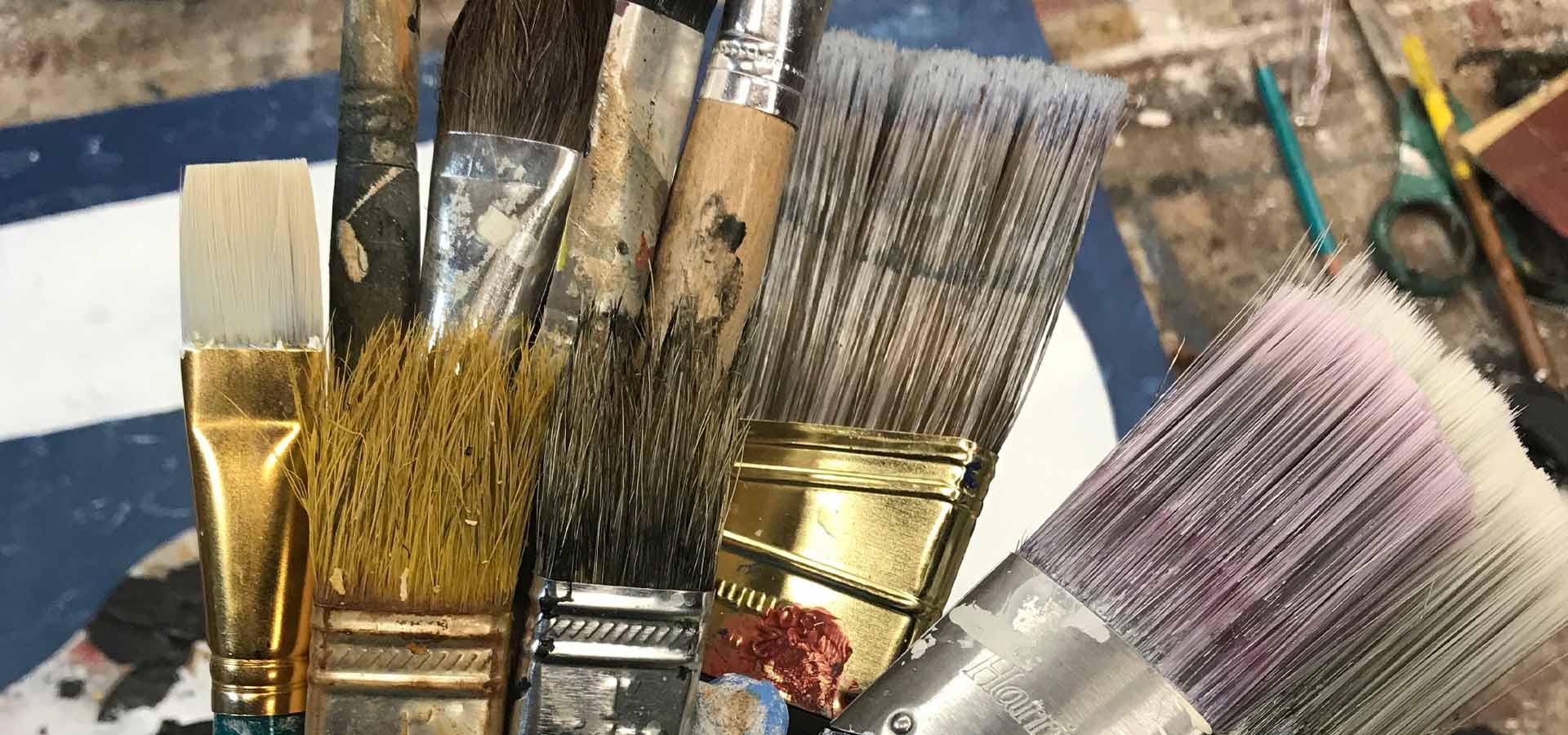 Paint brushes in the art studio of Domenick Naccarato. 