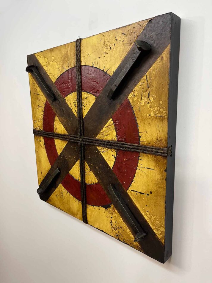 Assemblage wall art using railroad spikes, twine, and paint. Title: Circled X with Four Railroad Ties | 23.5"' x 23.5" | paint, joint compound, railroad spikes, screws, gummed paper tape, twine, oil stick, roofing tar, and polyurethane on plywood | 2021